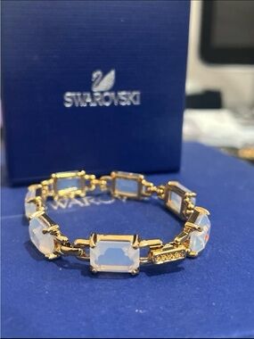 Swarovski opalite color bracelet with 14kt gold plated authenticity verified